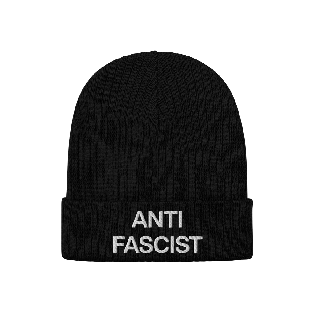 Black rib-knit beanie with “ANTI FASCIST” embroidered in white on the cuff, representing the Anti-Fascist Classic Hat—a