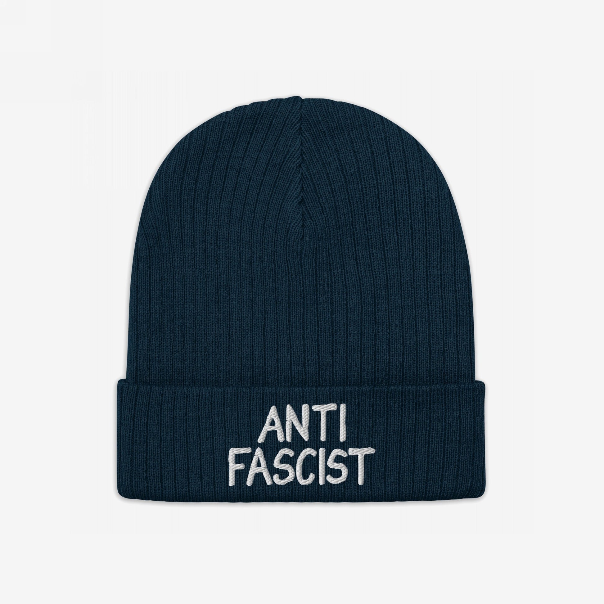 Dark-blue rib-knit beanie with “ANTI FASCIST” embroidered in white on the cuff, embodying protest spirit and ethical fashion.