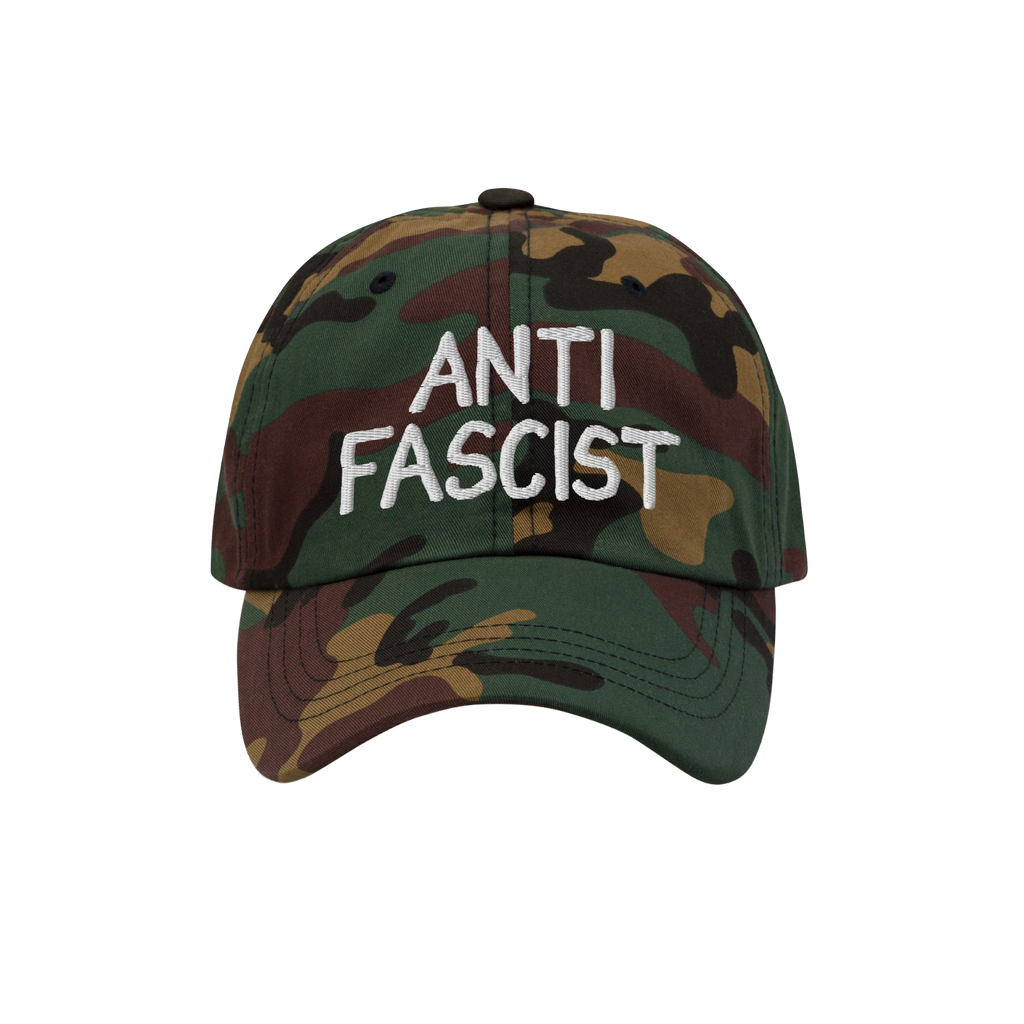 Woodland-camo baseball cap with ANTI FASCIST in white embroidery, combining style with activism. Ethically made, unisex, desi