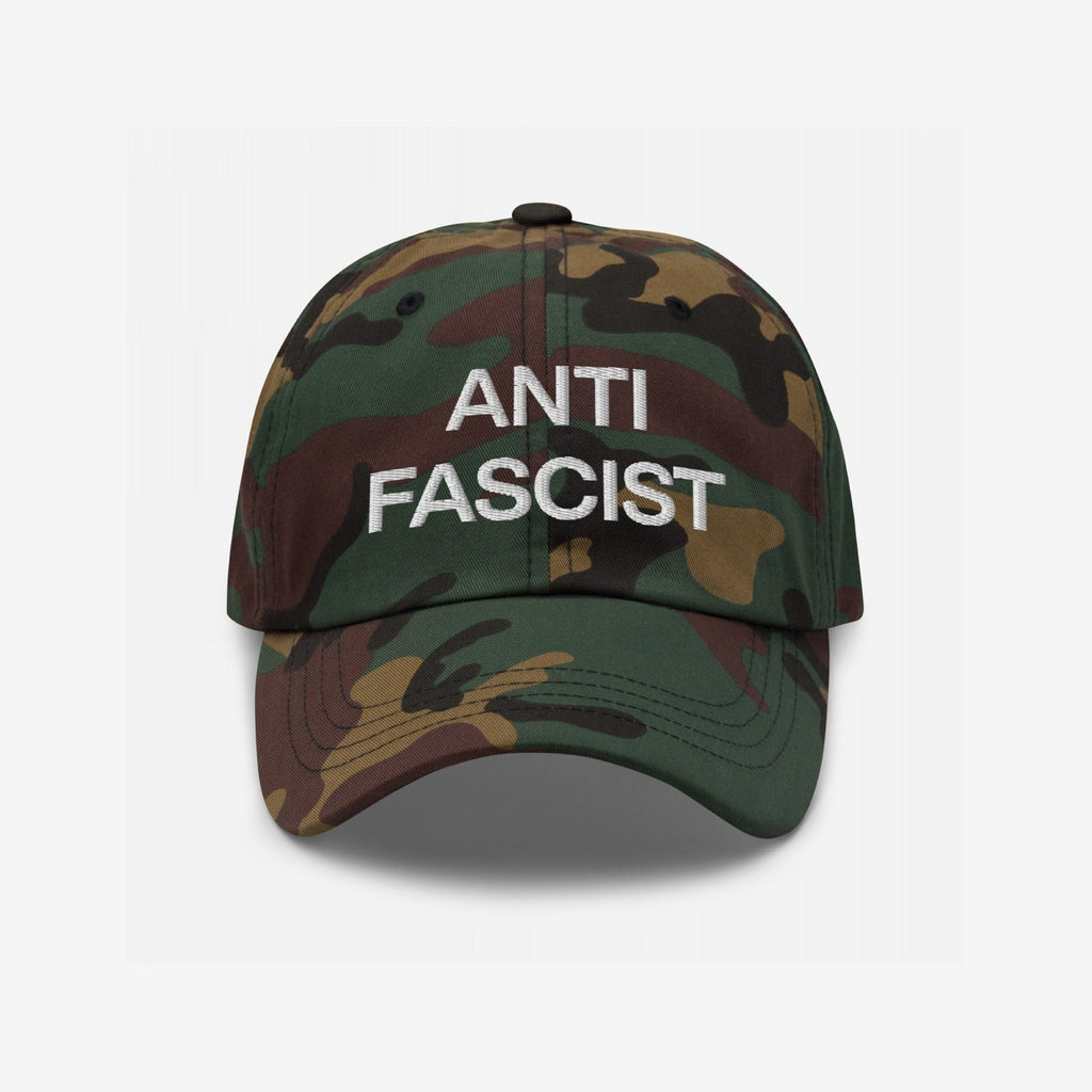 Camo-patterned Anti-Fascist Classic Hat with ANTI FASCIST embroidered in white, embodying bold resistance and timeless style. Perfect for those committed to standing firm against fascism.
