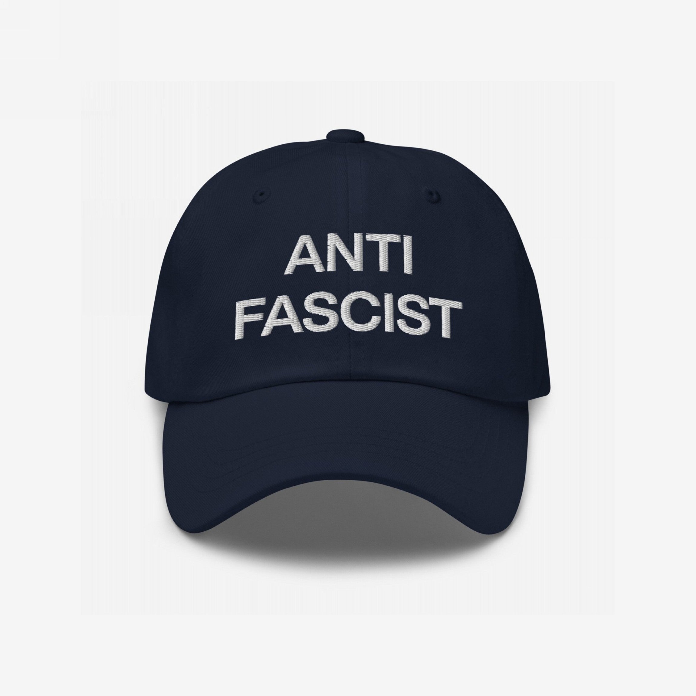 Anti-Fascist Classic Hat featuring ANTI FASCIST in bold white lettering on a navy baseball cap, embodying a strong stance against fascism with timeless style and conviction.