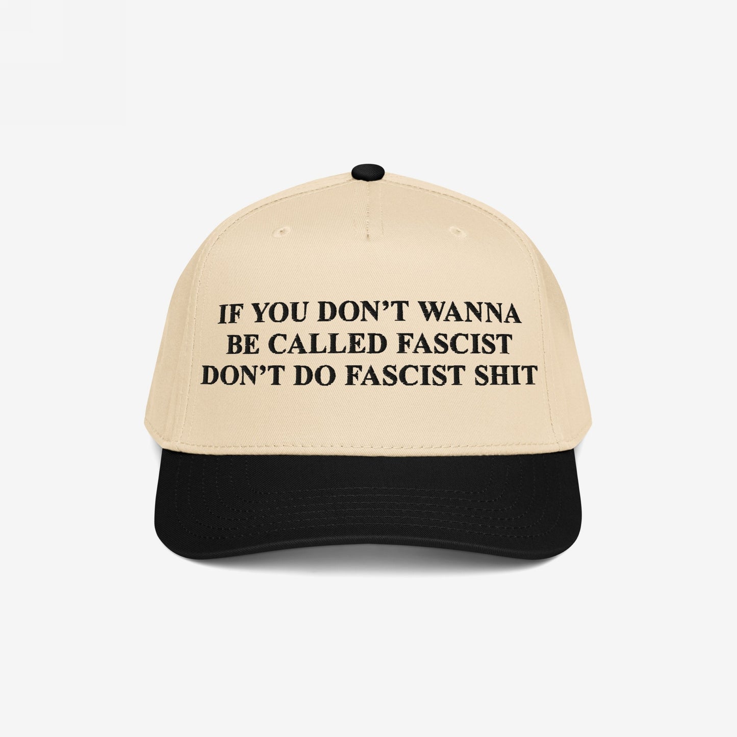 Anti-Fascist Retro 5-Panel Hat featuring a bold slogan in black text on its front panel, combining a light beige crown with a black brim, embodying fearless activism and statement-making style.
