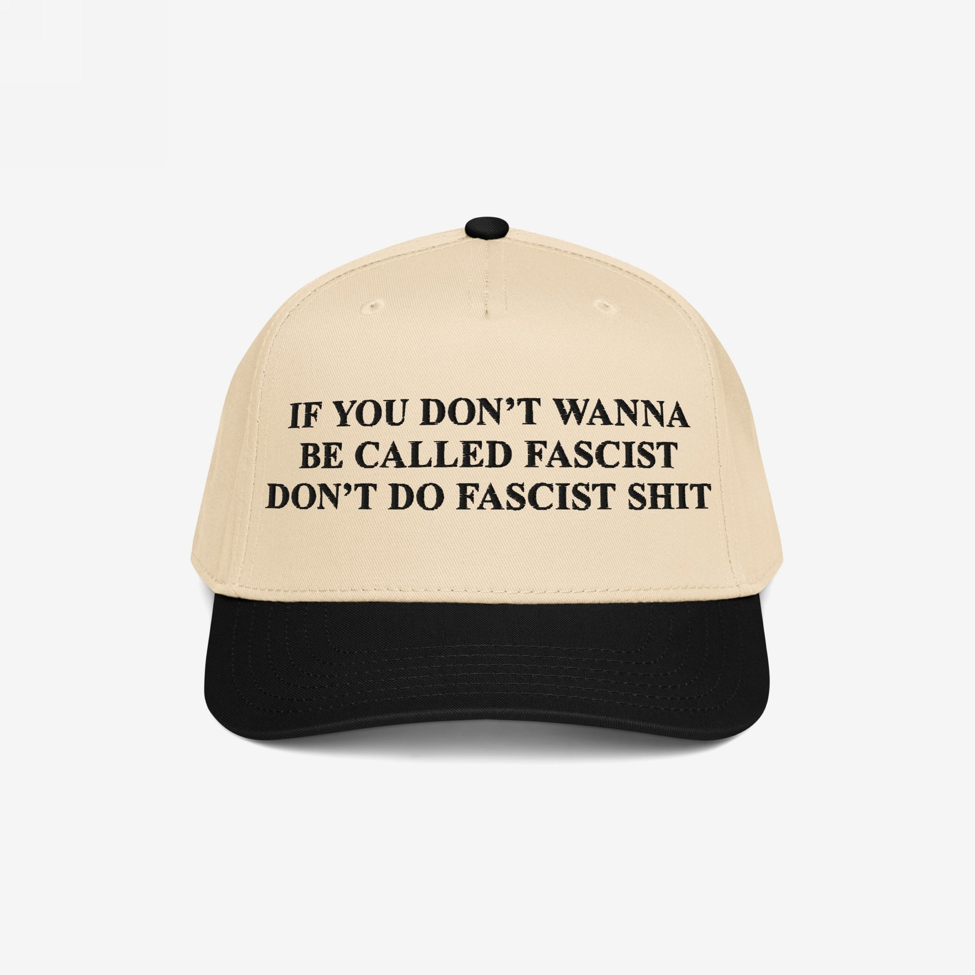 Anti-Fascist Retro 5-Panel Hat featuring a bold slogan in black text on its front panel, combining a light beige crown with a black brim, embodying fearless activism and statement-making style.