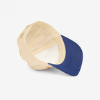 Anti-Fascist Retro 5-Panel Hat: A structured, mid-profile cap with a bold embroidered anti-fascism message, featuring a light beige crown and deep navy visor, viewed from above.