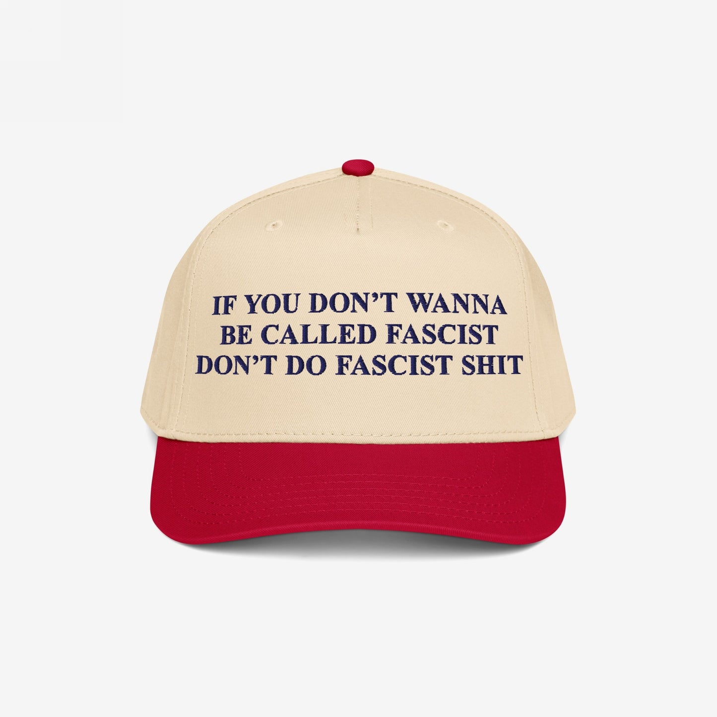 Anti-Fascist Retro 5-Panel Hat featuring bold dark blue lettering on a beige crown and red visor. Embroidered with a powerful anti-fascist message, it combines style and activism with an adjustable fit.