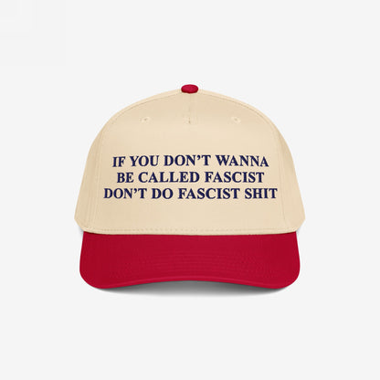 Anti-Fascist Retro 5-Panel Hat featuring bold dark blue lettering on a beige crown and red visor. Embroidered with a powerful anti-fascist message, it combines style and activism with an adjustable fit.