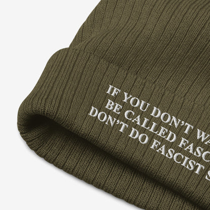 Anti-Fascist Retro Beanie: Olive-green ribbed knit beanie with white embroidered text reading IF YOU DON’T WANT TO BE CALLED FASCIST, DON’T DO FASCIST…, showcasing bold resistance style and warmth.