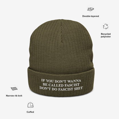 Anti-Fascist Retro Beanie featuring bold block white lettering with the slogan against fascism. This olive-green, double-layered knit hat is made from recycled polyester, perfect for making a statement.