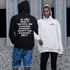 Two people showcase the Anti-Fascist Retro Shirt collection. One wears a black hoodie with a bold back message, while the other sports a light hoodie with ANTI FASCIST in red on the front.