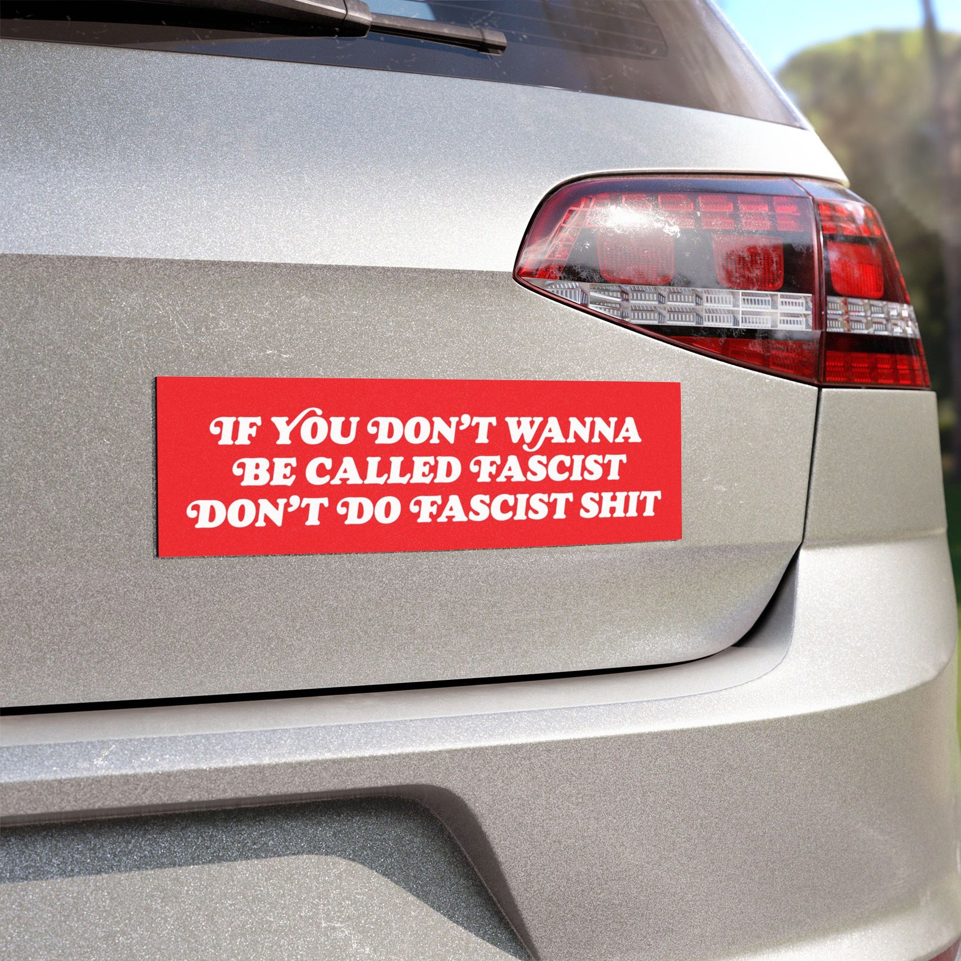 Anti-Fascist Retro Sticker & Magnet on a silver hatchback, displaying a bold message against fascism. Perfect for cars, laptops, or fridges, showcasing all-weather durability and a strong anti-fascist stance.