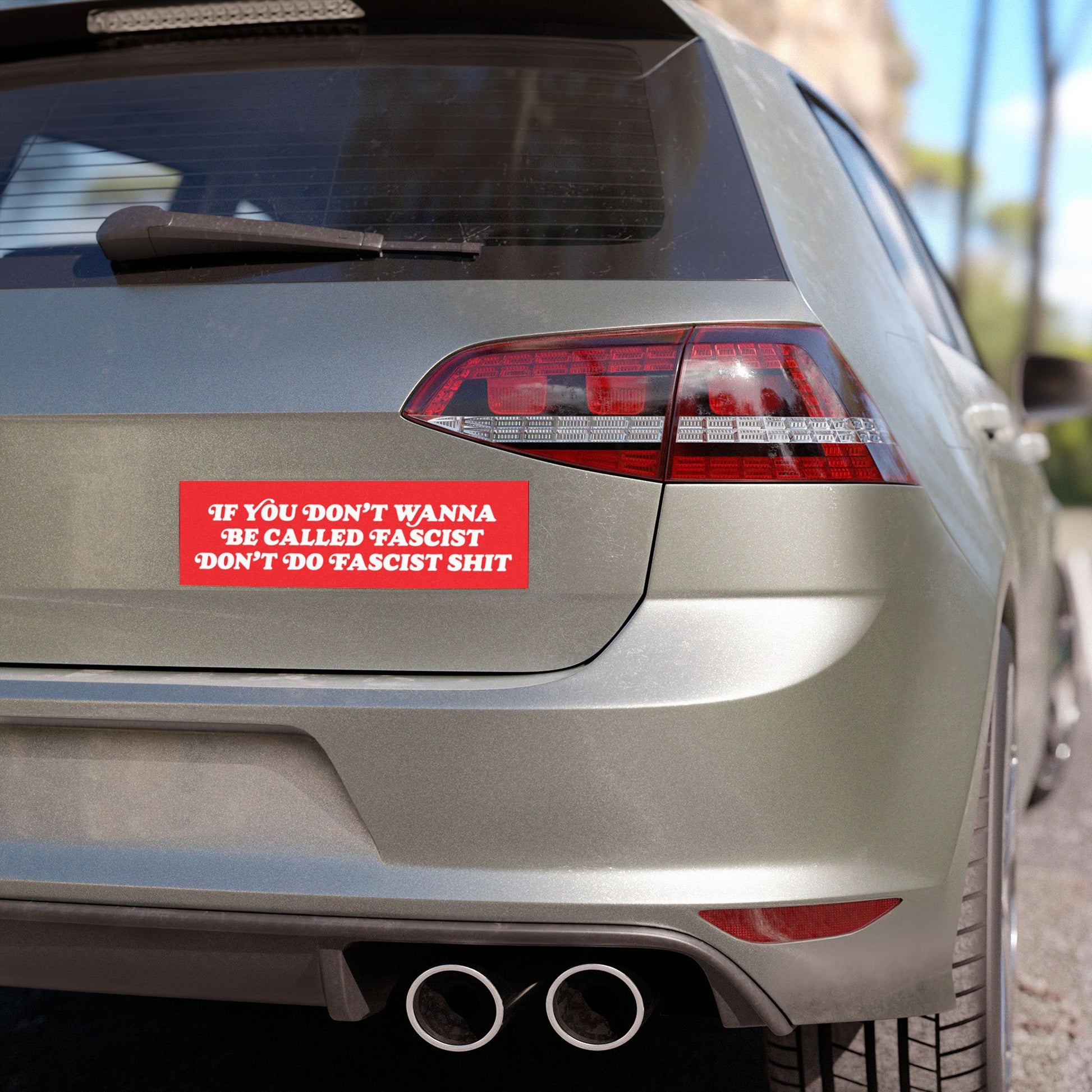 Rear view of a silver hatchback with an Anti-Fascist Retro Sticker & Magnet on the tailgate, boldly stating, If you don’t wanna be called fascist, don’t do fascist shit, showcasing defiance and durability.