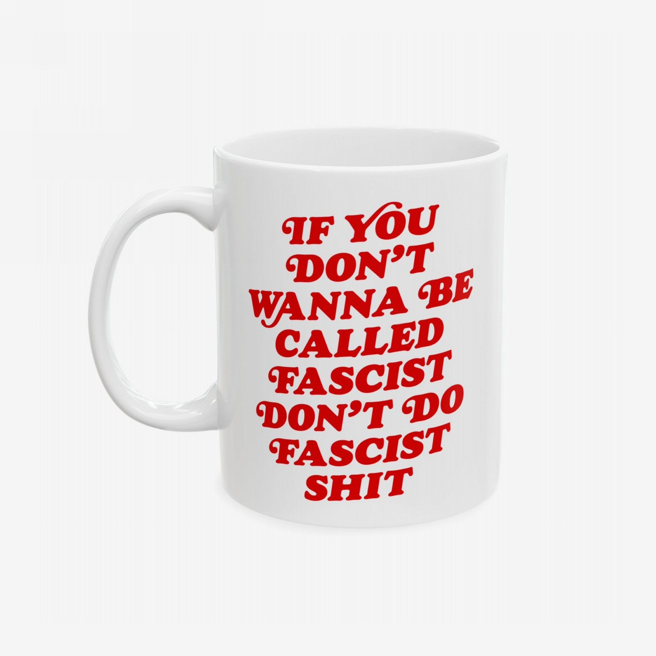 Anti-Fascist Retro Mug with bold red text, If you don’t wanna be called fascist, don’t do fascist shit, on a white ceramic surface, embracing resistance. Available in 11 oz. and 15 oz. sizes.