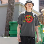 Young man wearing the Anti Fascist Shirt, featuring a bold red circle and Power to the People slogan, embodying skate style and progressive resistance against oppression, standing in an alley.