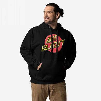 Anti-Fascist Hoodie & Sweatshirt featuring a red circle with bold yellow ANTI FASCIST lettering, worn by a man with hands in the pocket against a light background.
