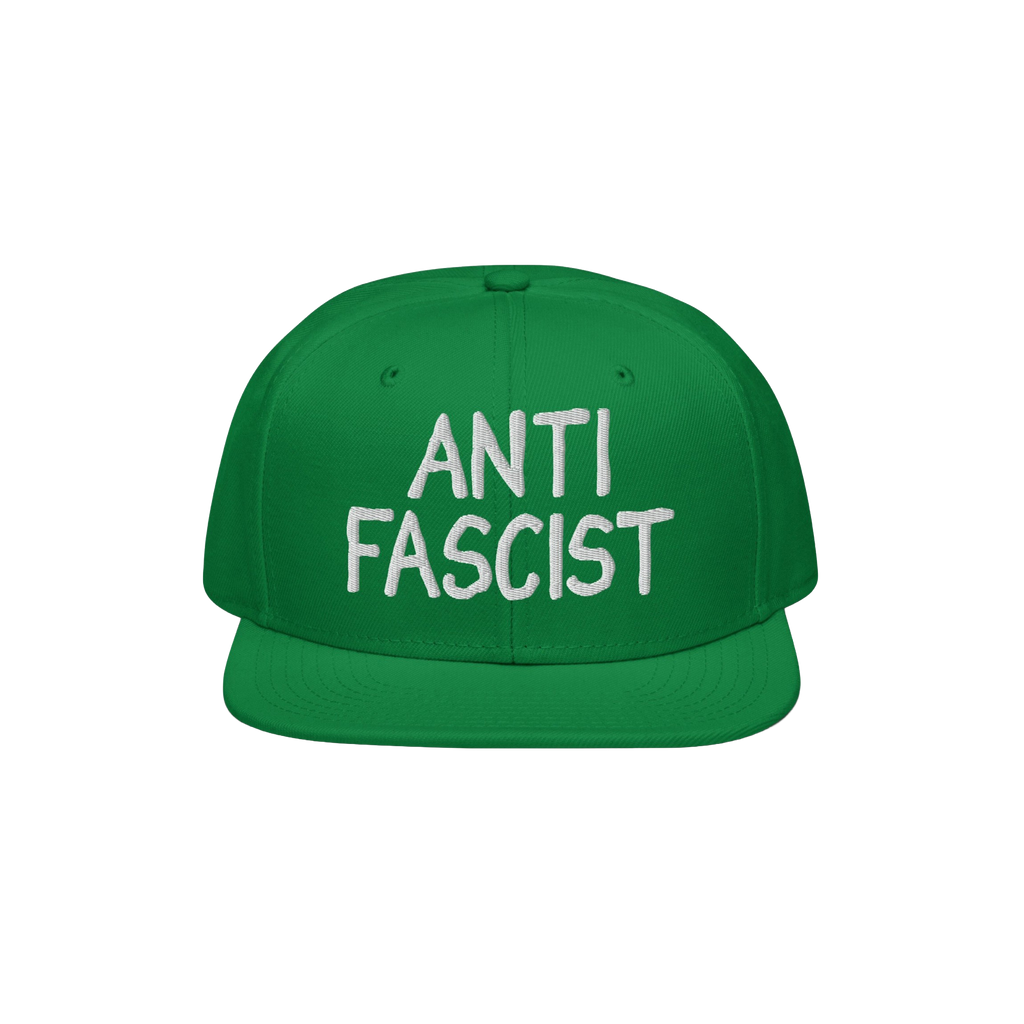 Green flat-brim snapback hat with ANTI FASCIST embroidered in white on the front, embodying a bold statement against fascism.