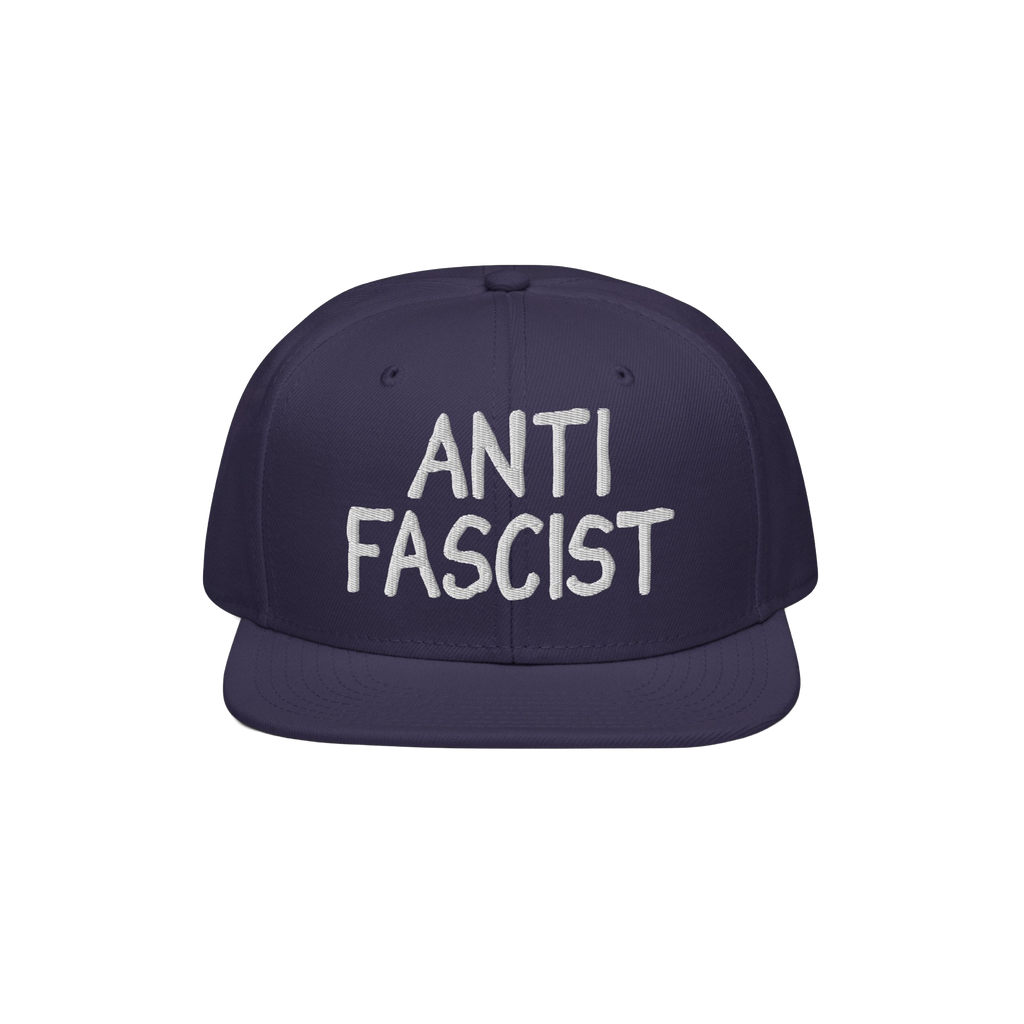 Navy-blue flat-brim snapback hat with ANTI FASCIST in white embroidery, reflecting a bold, unisex statement for those opposin