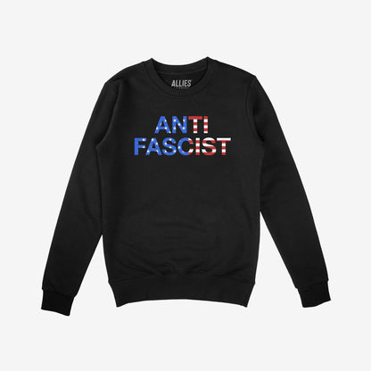 Black crewneck Anti-Fascist USA Classic Sweatshirt featuring ANTI FASCIST in an American-flag motif, reflecting activism and patriotism against tyranny. Branded “ALLIES” on the inside collar.
