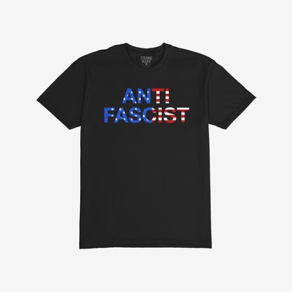 Anti-Fascist USA Classic T-shirt featuring bold ANTI FASCIST text in stars-and-stripes pattern, symbolizing reclaimed patriotism. Ideal for activism and expressing support for equity and justice.
