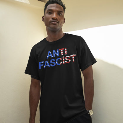 A young man models the Anti-Fascist USA Classic T-shirt featuring bold ANTI FASCIST text with an American-flag motif, embodying a message of equity and justice.