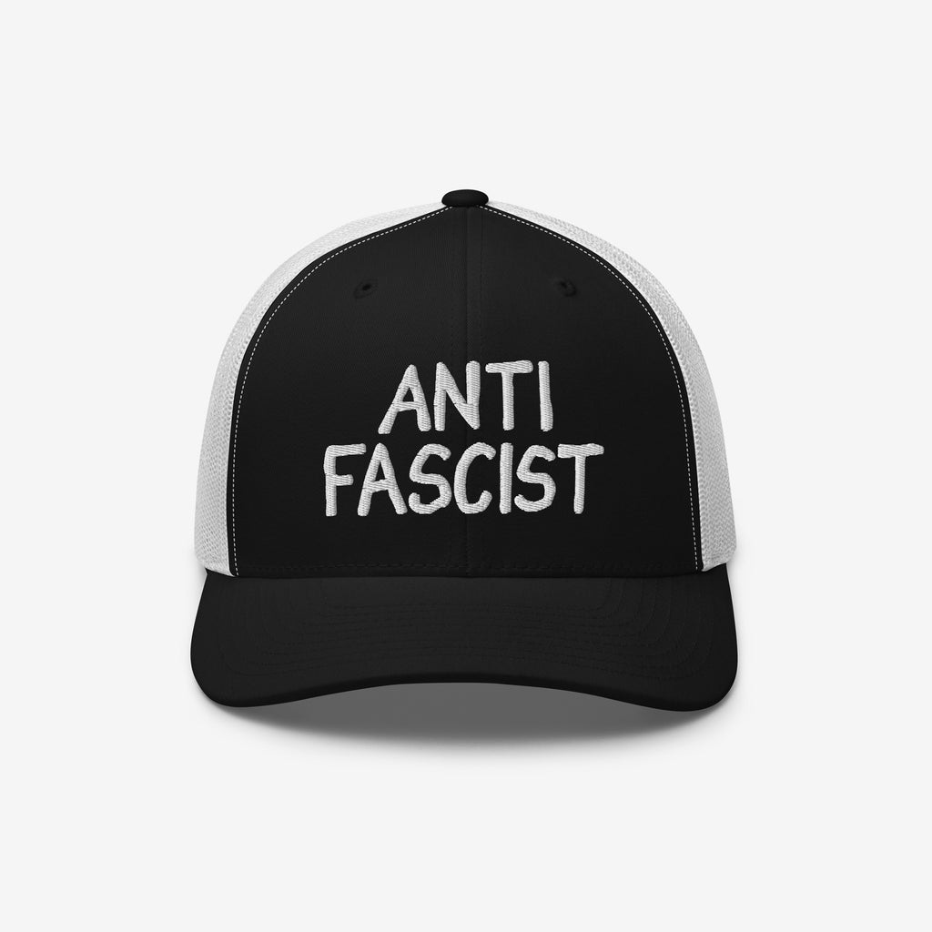Anti Fascist Hat with a black front and white mesh back, featuring “ANTI FASCIST” embroidered boldly in white, embodies a statement of resistance and style, supporting ACLU's mission.