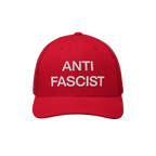The Anti-Fascist Classic Hat features bold, white embroidered ANTI FASCIST lettering on a red trucker-style cap, embodying a 