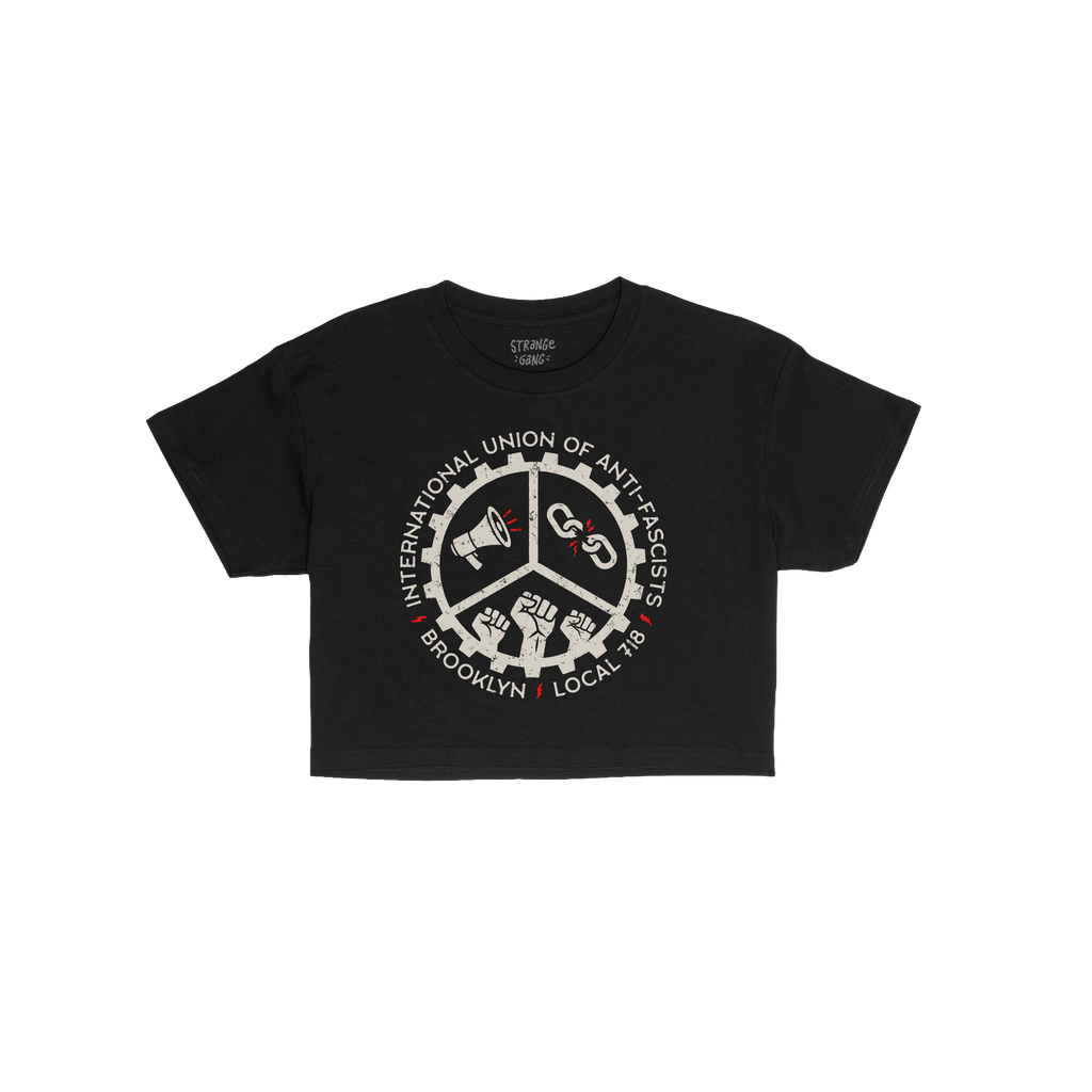 Brooklyn Anti-Fascist Union Women's Baby Tee features a distressed white gear logo with megaphone, broken chains, and raised 