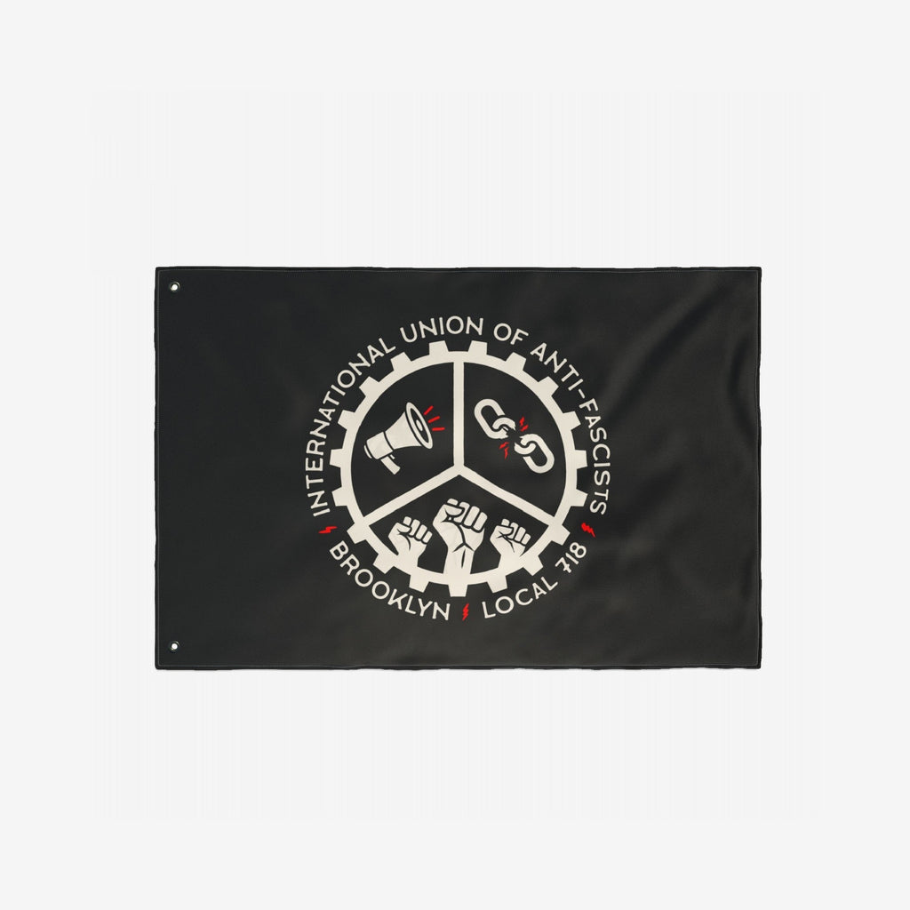 Brooklyn Anti-Fascist Union Flag featuring a central emblem with a megaphone, broken chain, and raised fists, symbolizing resistance and solidarity. A bold statement piece for anti-fascism supporters.