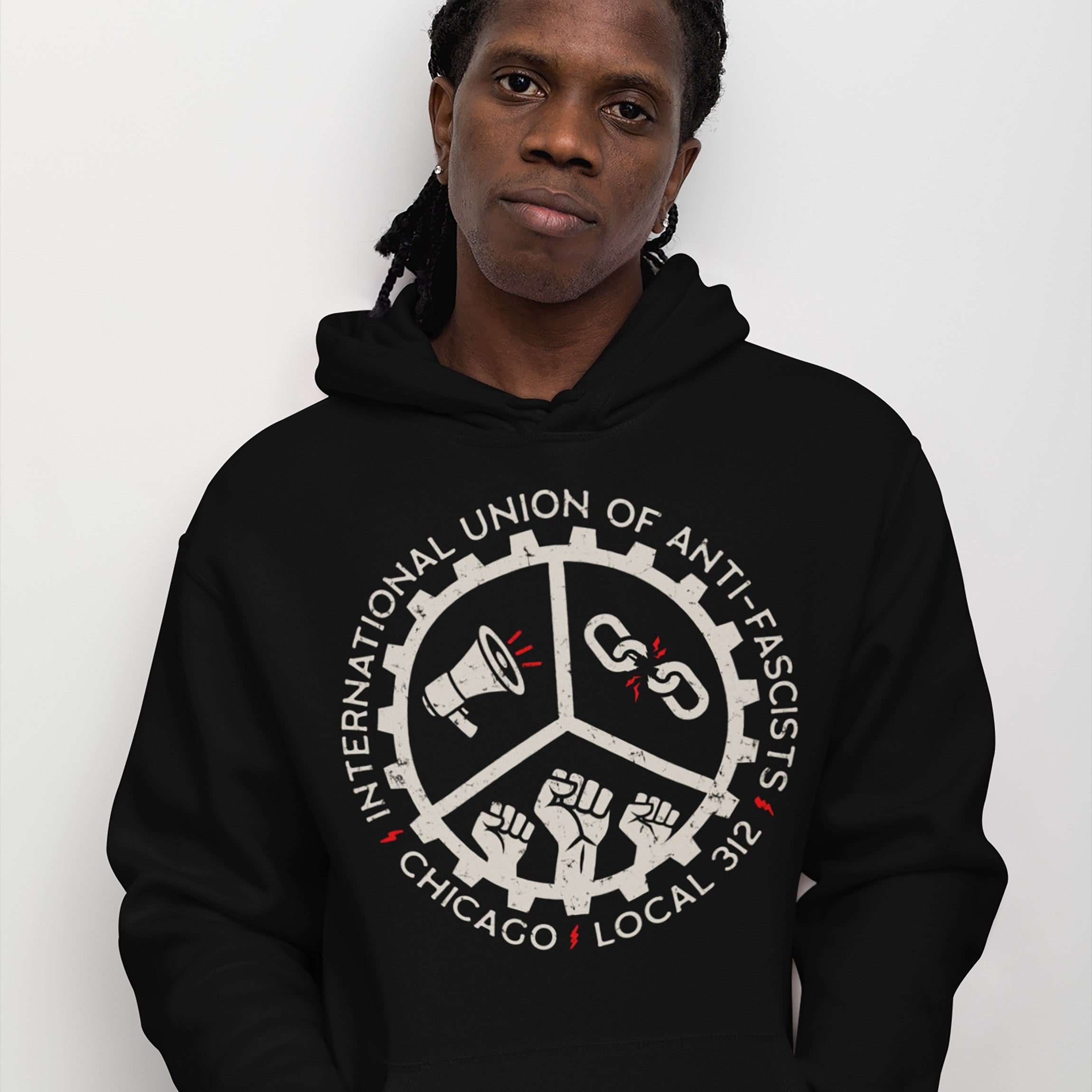 Chicago Anti-Fascist Union Hoodie features a cog-wheel logo with a megaphone, broken chain, and raised fists, symbolizing activism. Text reads “International Union of Anti-Fascists” and “Chicago Local 312.”