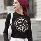 Young person models Chicago Anti-Fascist Union T-shirt with gear emblem, symbols of activism, and local text. Paired with headscarf, hoop earrings, white pants, and shoulder bag, reflecting bold, political style.