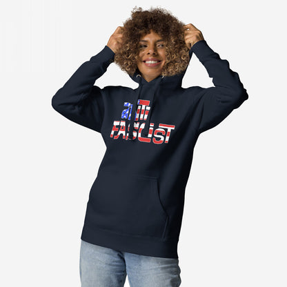 Model smiling while wearing the Anti-Fascist USA Hoodie, featuring a stars-and-stripes slogan. This fleece embodies resistance and patriotism, perfect for showing your stance against hate and supporting equality.