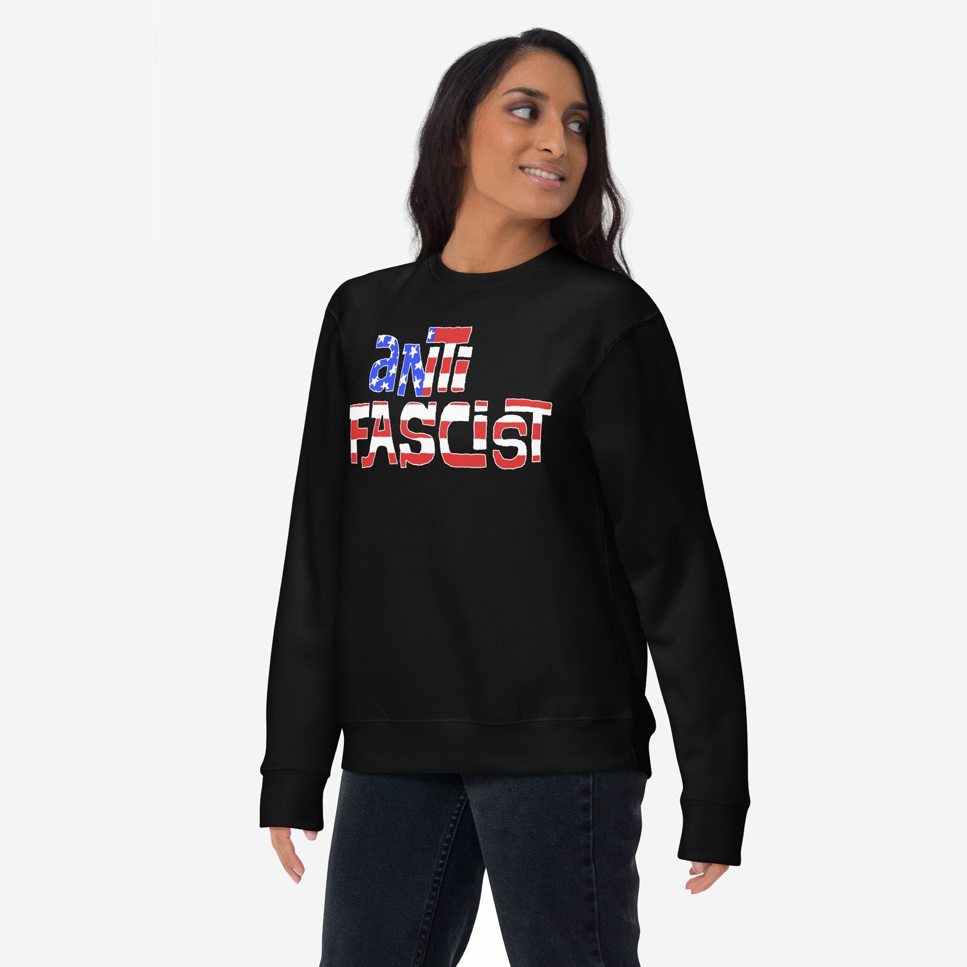 Anti-Fascist USA Hoodie & Sweatshirt features a bold ANTI FASCIST stars and stripes design, worn casually by a person, symbolizing resistance and reclaiming patriotism. Ideal for those advocating equality and justice.