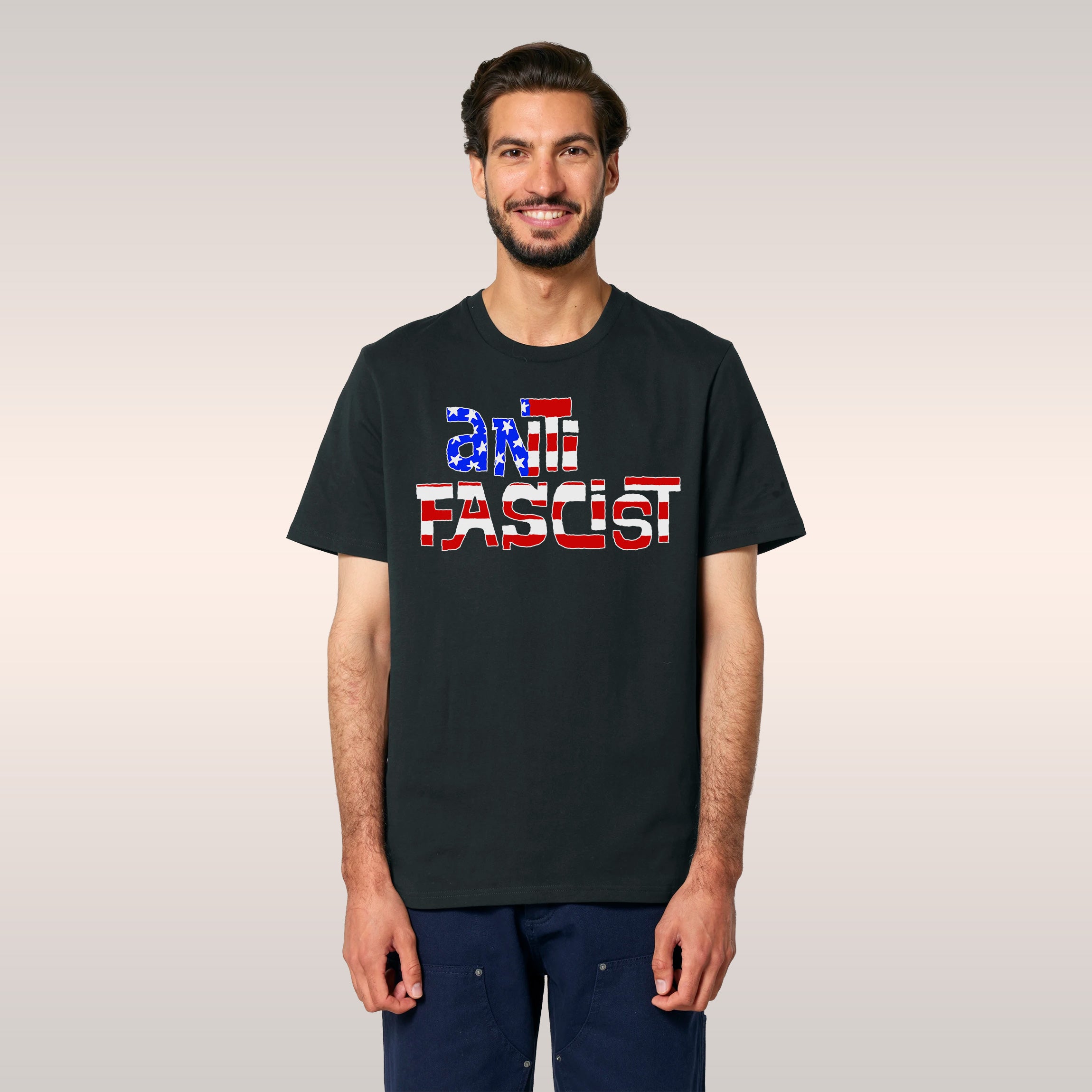 Young man wearing the Anti Fascist USA Shirt featuring ANTIFASCIST with stars-and-stripes motif, embodying urban streetwear s