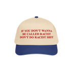 Anti-Racist Hat with bold red slogan on a light tan crown and royal blue bill, challenging racist behavior with unapologetic 