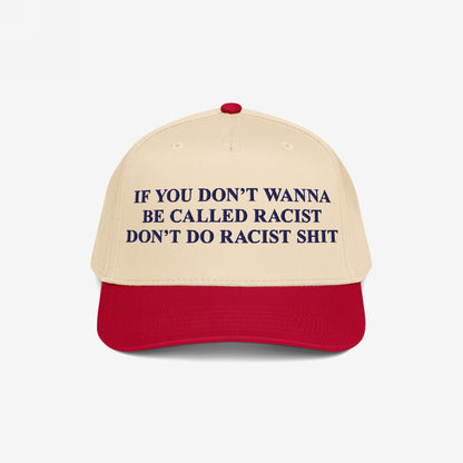 Anti-Racist Hat with a bold message embroidered in dark blue: If you don’t wanna be called racist don’t do racist shit, on a beige crown and red bill.