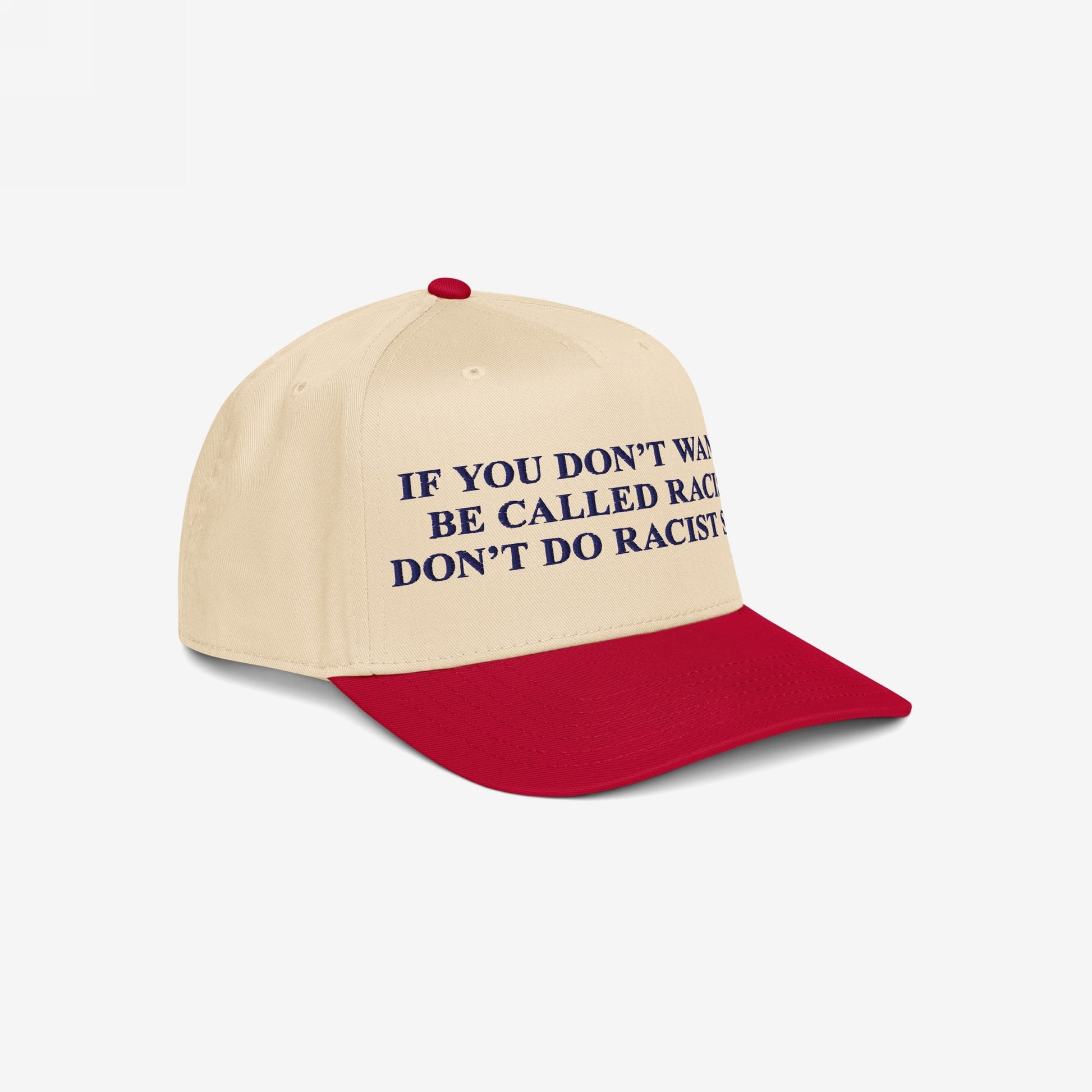 Anti-Racist Hat with bold slogan in dark blue block letters, advocating against racism. Featuring a red brim and beige crown, it makes a clear, unapologetic statement against racial injustice.