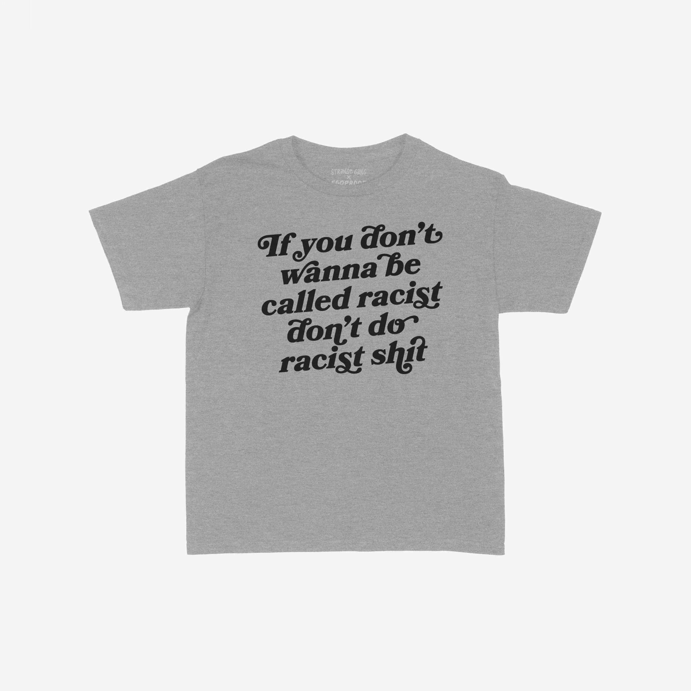 Anti-Racist Women's Baby Tee EU features a heather-gray design with a bold black slogan demanding action against racism, embodying empowerment and activism in a fitted, cropped style.