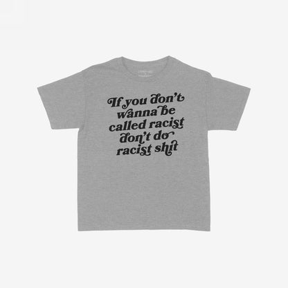Anti-Racist Women's Baby Tee EU features a heather-gray design with a bold black slogan demanding action against racism, embodying empowerment and activism in a fitted, cropped style.