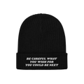 Anti-Racist Hat featuring a bold message in white block letters on a black rib-knit beanie with a folded cuff, challenging ra