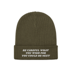 Olive-green Anti-Racist Hat with ribbed knit texture and folded cuff, featuring a bold, embroidered slogan against racism in 
