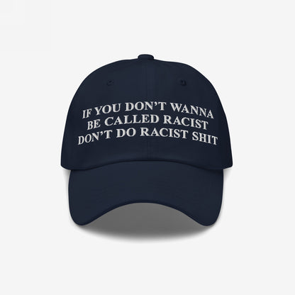 Navy-blue Anti-Racist Hat with bold white embroidery stating, “If you don’t wanna be called racist don’t do racist shit,” symbolizing a firm stance against racism and promoting truth.