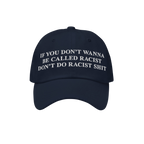 Navy-blue Anti-Racist Hat with bold white embroidery stating, “If you don’t wanna be called racist don’t do racist shit