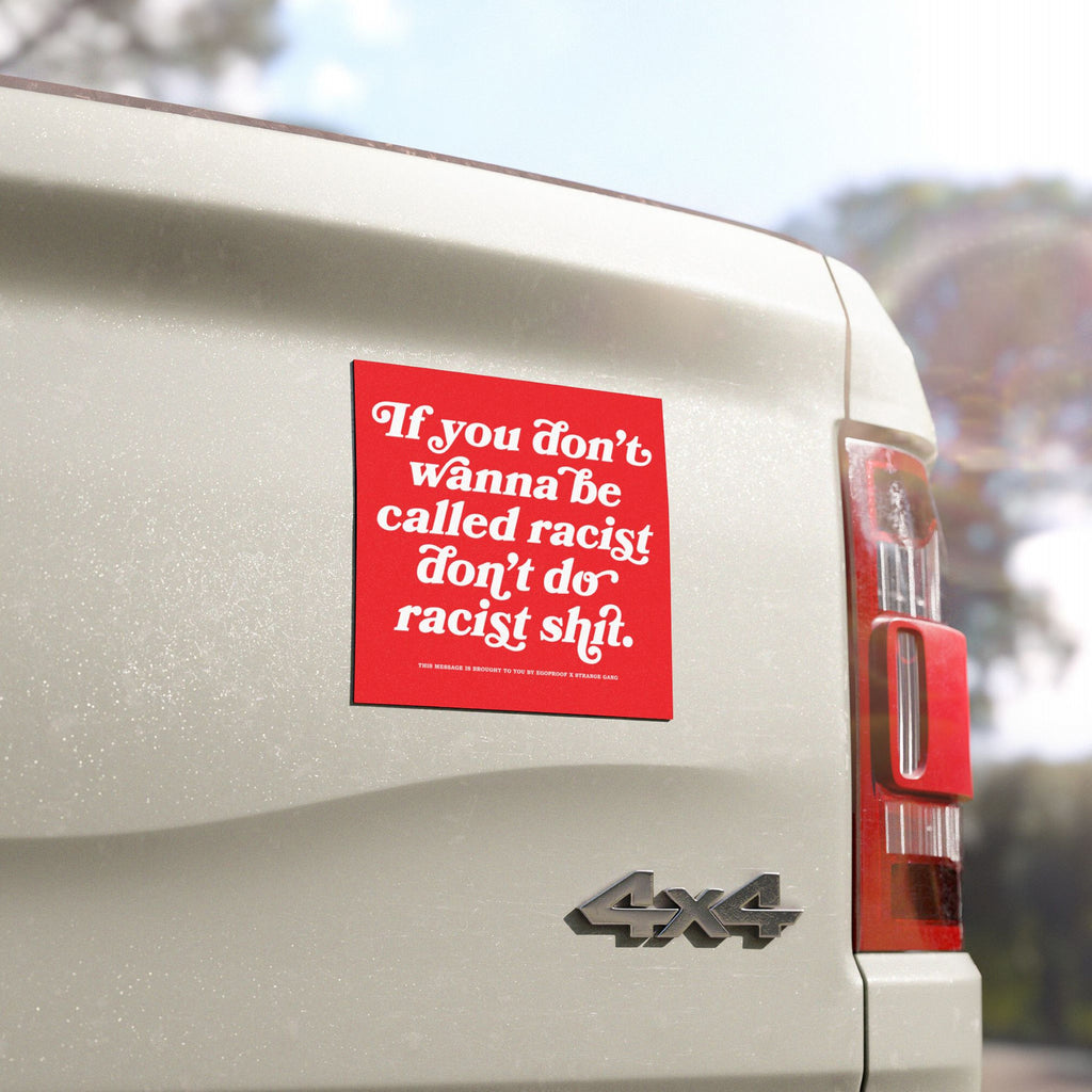 Anti-Racist Sticker & Magnet on a white 4x4 pickup's tailgate with bold message advocating against racism, reflecting the ethos of equality and empowerment through durable, visible messaging.
