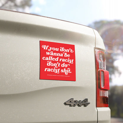 Anti-Racist Sticker & Magnet on a white 4x4 pickup's tailgate with bold message advocating against racism, reflecting the ethos of equality and empowerment through durable, visible messaging.