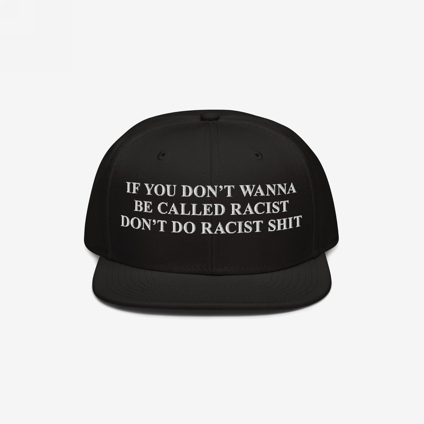 Black snap-back Anti-Racist Hat with bold white embroidery: “If you don’t wanna be called racist, don’t do racist shit,” reflecting a firm stance against racism and promoting equality.