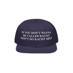 Dark navy Anti-Racist Hat with bold white text, “If you don’t wanna be called racist don’t do racist shit,” highlight