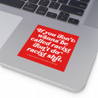 Silver laptop showcasing the Anti-Racist Sticker & Magnet with bold text: “If you don’t wanna be called racist don’t do racist shit.” Positioned below the keyboard, it represents a clear stance against racism.