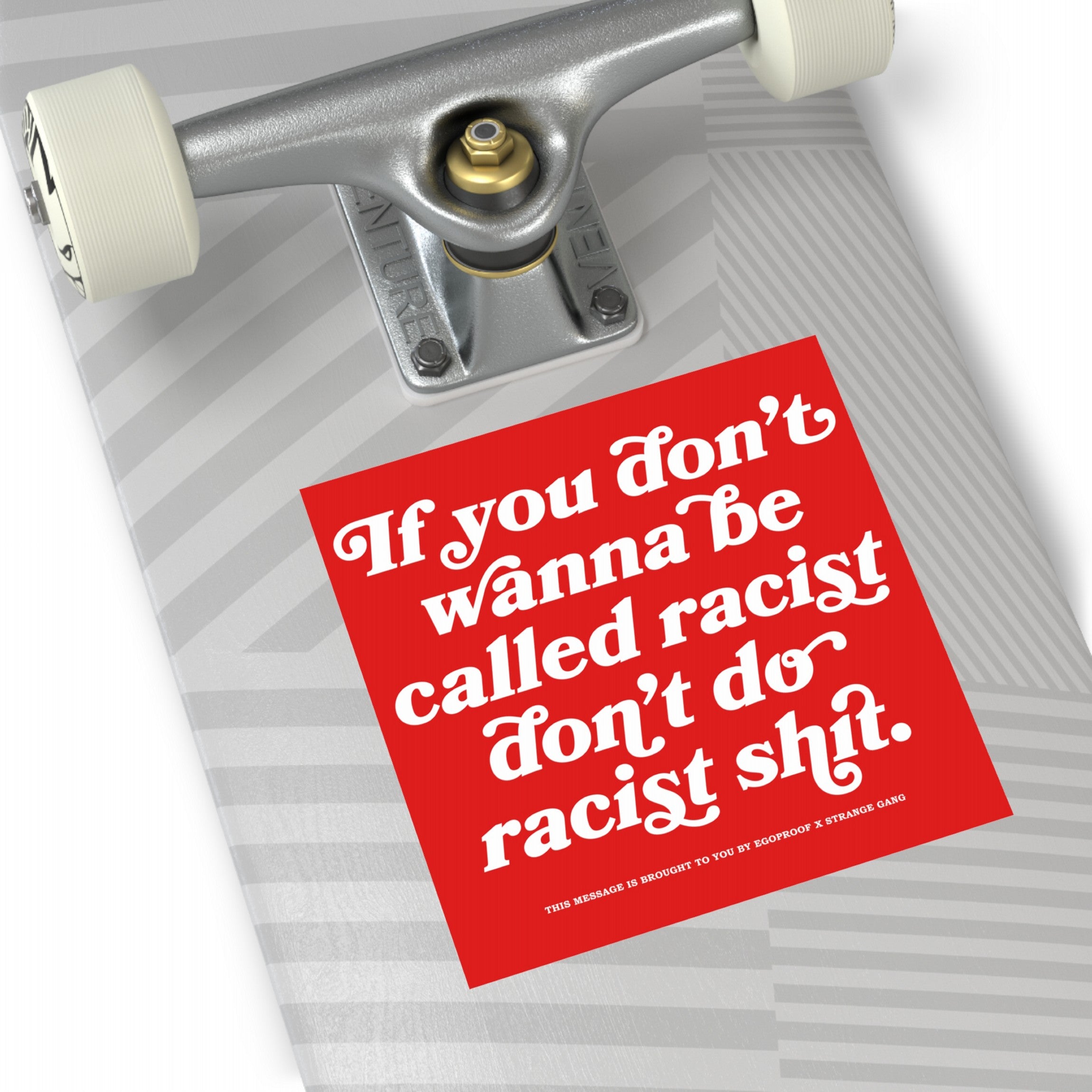 Anti-Racist Sticker & Magnet on skateboard deck, featuring a bold message against racism, partnered by EgoProof. The sticker and magnet emphasize durability and clarity, perfect for visible, impactful placement.