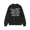 A black crewneck sweatshirt with bold white text: “If you don’t wanna be called racist don’t do racist shit.” Label r