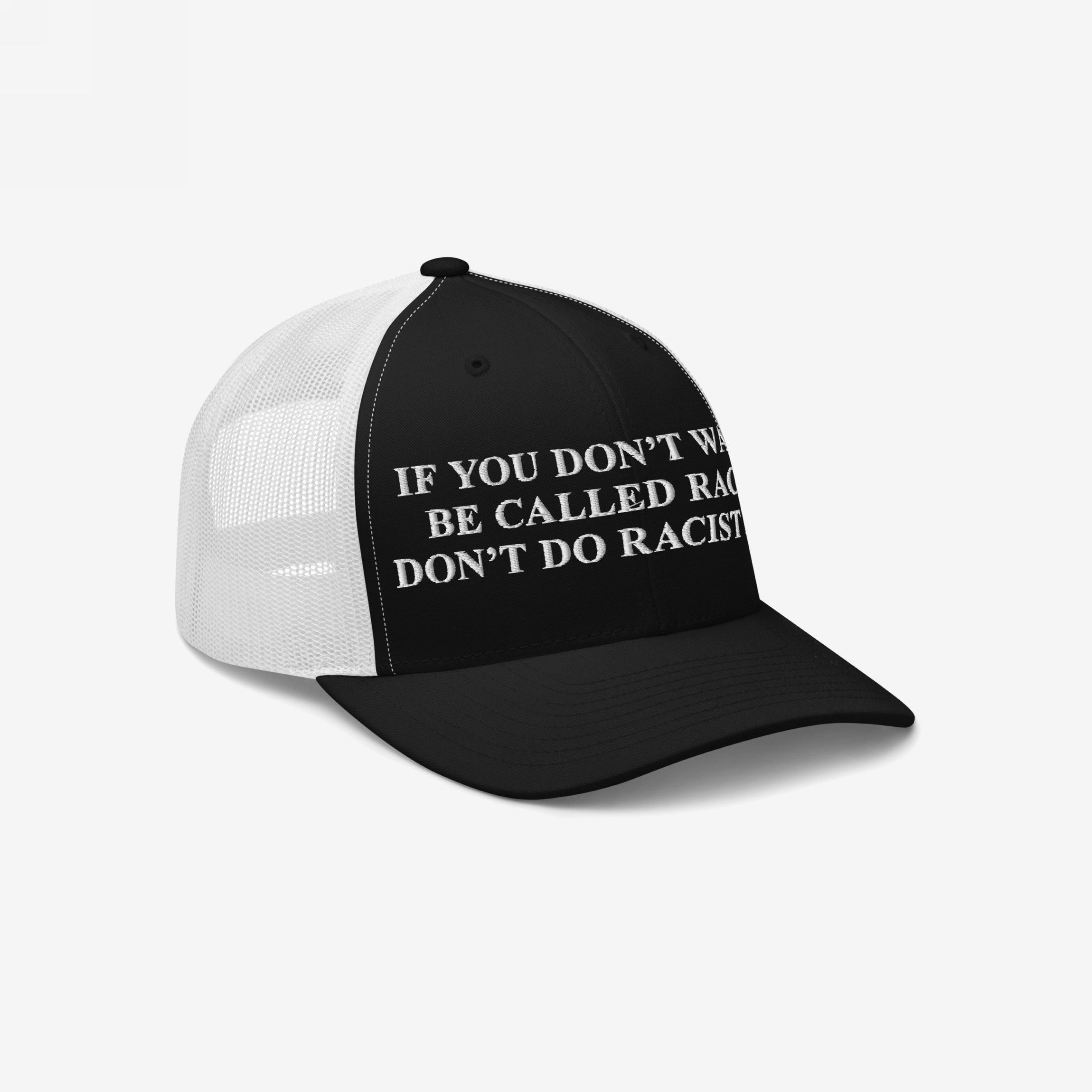 Anti-Racist Hat featuring a bold slogan embroidered on a trucker-style cap with a black front and white mesh back, symbolizing a clear stance against racism and promoting equality.