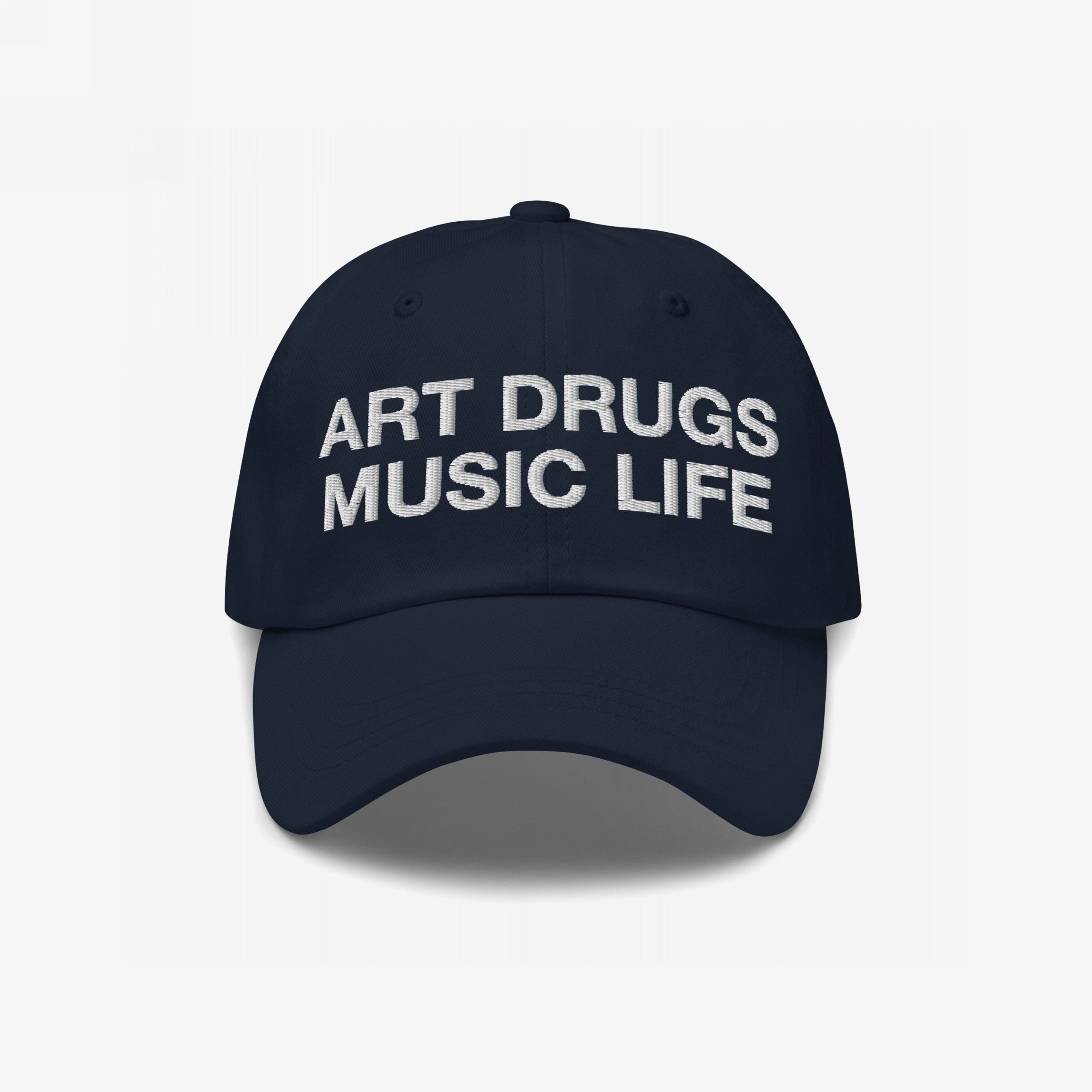 Dark navy Art Drugs Music Life Hat with white embroidered slogan, embodying creativity and expression. Ideal for those embracing art's vibrant chaos. Available in snapback, dad, and trucker styles.